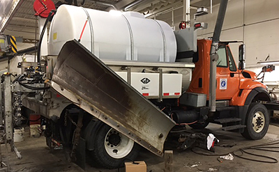 Photo of truck with potassium acetate tanks.